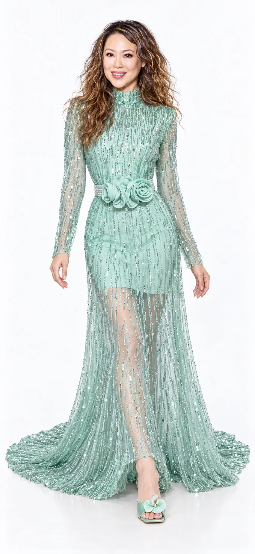 Sue Wang in a seafoam embellished gown with a floral belt